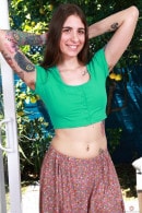 Pearl Sage In Her Green Top And Baggy Pants