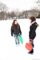 Two cute girls on a sled